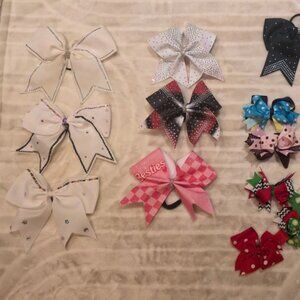 Lot of cheer bows in assorted colors. Some smaller clip bows